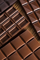Chocolate bar, candy sweet, dessert food on wooden background