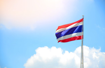 Thai flag against blue sky