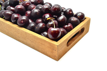 Fresh and sweet cherry in wooden box