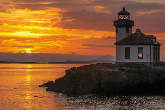 Deep Orange Sunset of a Lighthouse on the San Juan Islands in Washington State