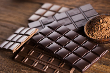Bars Chocolate , candy sweet, dessert food on wooden background