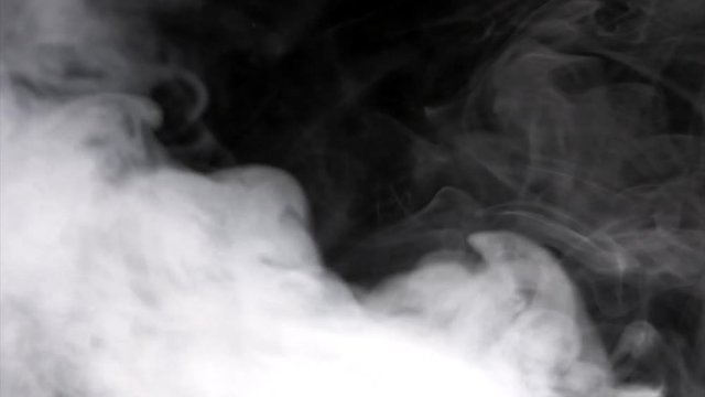 White smoke billows over a black background. HD 1080.