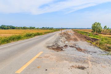 Damaged asphalt road