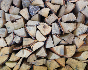 Background of dry chopped firewood logs