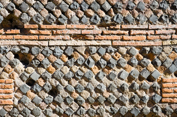 Ruins of Ostia antica, Rome. Detail of a typical roman wall made of red bricks and terracotta