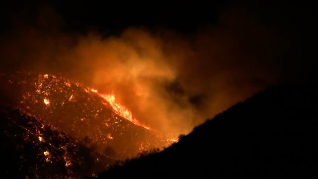 Night shot of hillside from the recent fires in Southern California. This clip was taken near Magic Mountain in Valencia, CA. HD 1080.