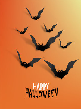 Paper bats with realistic shadows on the orange background