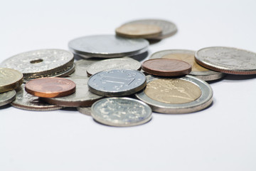 Heap of coins on white background