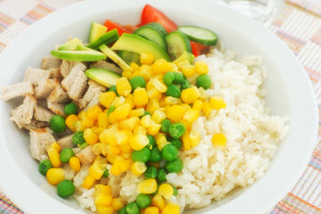 Rice with fresh vegetables and meat slices