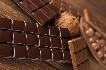 Chocolate bar, candy sweet, dessert food on wooden background