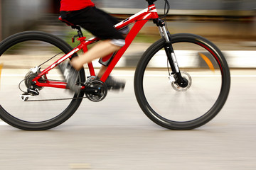 Fototapeta na wymiar Biking in the morning with leg movements cyclists blurry