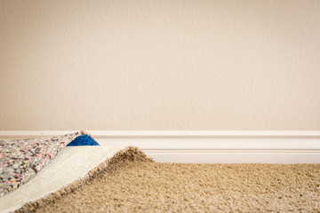 Pulled Back Carpet and Padding In Room of House. © Andy Dean