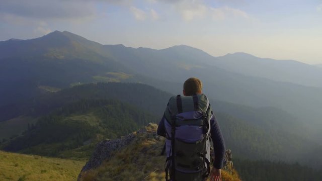 3 in 1 video! The climber walk the mountain cliff against the background of the fog. Real time capture. Wide angle