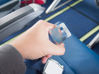 Close-up of a safety belt in the airplane
