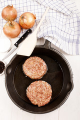meat balls with sunflower oil in a cast iron pan