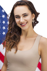 Happy young woman on a background of the American flag