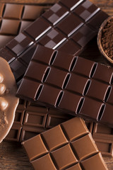 Chocolate bar, candy sweet, dessert food on wooden background