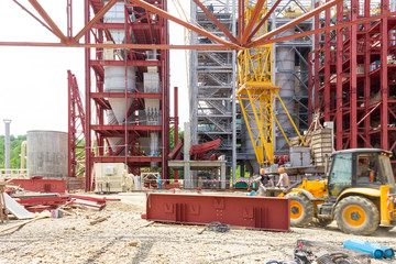 Industrial Construction. Workers Assemblers On The Excavator On The Construction Of An Industrial...