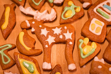 Fototapeta na wymiar Gingerbread colorful decorated cookies - Christmas moose. hearts, moon, fish