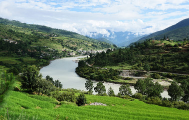 A view from the mountain over the green valley of Punakha