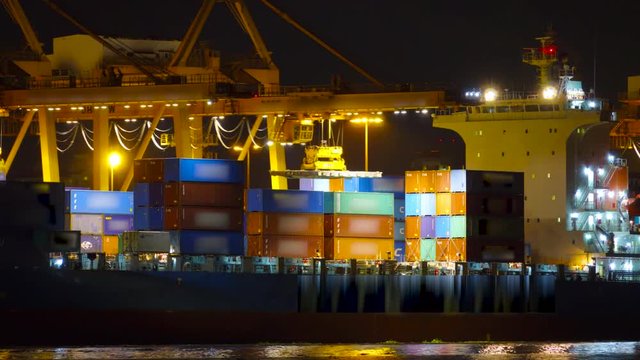 Cargo ship moving load at port , present by timelapse