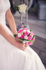 Obraz na płótnie Canvas bridal bouquet of pink color in hands