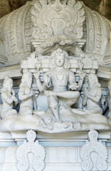 Fototapeta na wymiar Sculpture of Shiva and sages-Rishi on one of the towers of ancient temple Arunachaleswara, XVI century. Tiruvannamalai, South India.