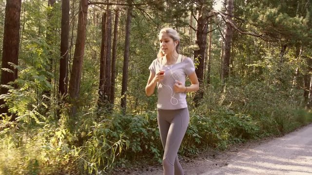 Young woman is running in the morning to keep fit