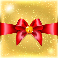 Red Christmas bow with bell. New Year accessory. Satin ribbon. Gold wrapping paper. Gift box. Blink. Celebration.