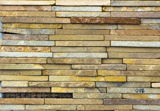texture of colored sandstone bricks close-up,