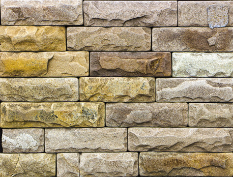 texture of yellow sandstone bricks close-up,
