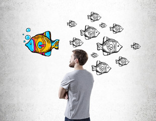 Man looking at fish sketch