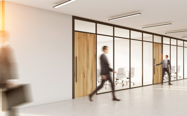 Conference room with people in corridor