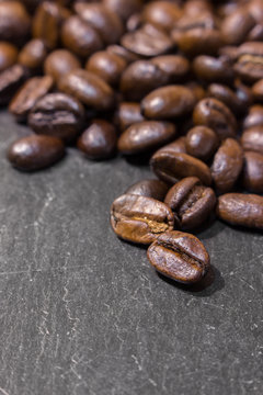 Coffee beans on black stone table © toonzzz