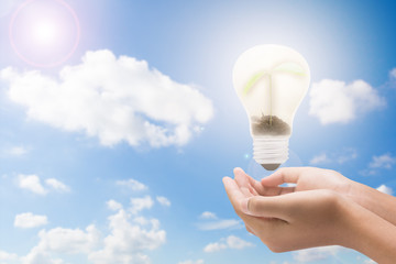 Light bulb in woman hand,Realistic photo image. Turn on tungsten