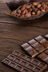 Bars Chocolate , candy sweet, dessert food on wooden background