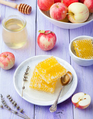 Honey, honeycombs and fresh apples Top view
