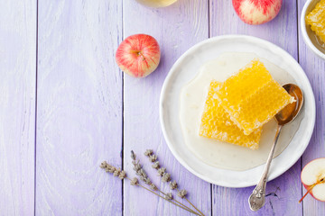 Honey, honeycombs and fresh apples Copy space