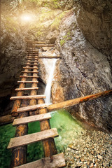 old wooden stairs over the mountain waterfall.natural background
