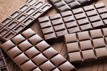 Chocolate bar, candy sweet, dessert food on wooden background