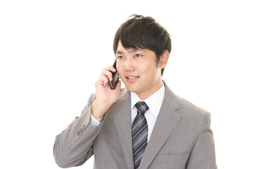 通話中の笑顔のビジネスマン