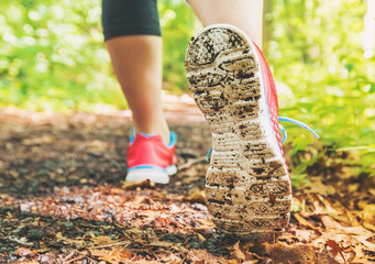 Female jogger on a forest trail