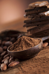 Chocolate bar, candy sweet, dessert food on wooden background