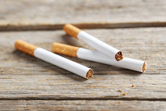 Tobacco cigarettes on a grey wooden table