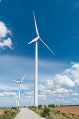 Fototapeta premium Wind turbine and blue sky background.