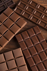 Chocolate bar, candy sweet, dessert food on wooden background