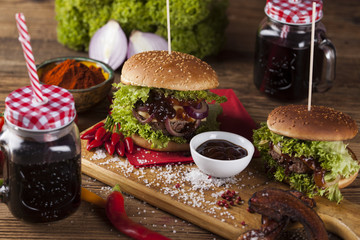 Close-up of home made burgers, wooden desk background