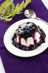 Sweet pudding with blueberry confiture
