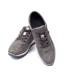 Female suede sneakers isolated on white background with clipping path