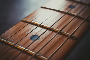 Electric guitar neck detail, music symbol